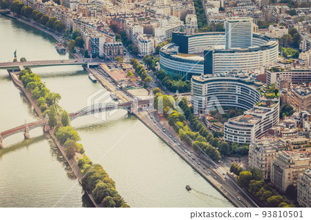 Seine River and contemporary parisian roofs at sunrise Paris, France 93810501