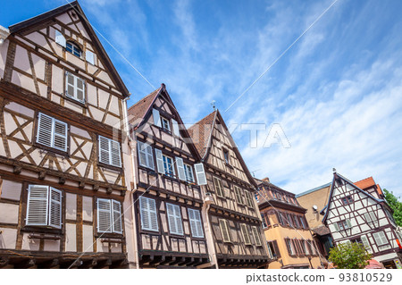 Colmar alsatian architecture at springtime with flowers, Eastern France 93810529