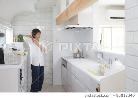 Middle Japanese woman suffering from stiff shoulders Middle Japanese woman suffering from stiff shoulders 93812340