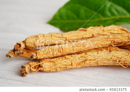 Ginseng roots and green leaf, healthy food. Ginseng roots and green leaf, healthy food. 93813375