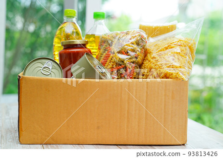 Foodstuffs in donation box for volunteer. 93813426