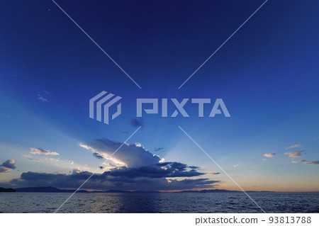 Summer coastal evening view with cumulonimbus clouds blocking the setting sun, ultra-wide angle, mainly sky, 220706pm 93813788