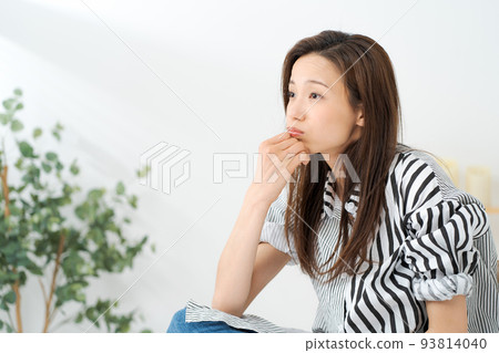 A woman relaxing at home A woman relaxing at home 93814040