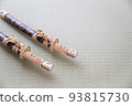 A short Japanese sword placed in a Japanese-style room 93815730