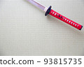 A red Japanese sword placed in a Japanese-style room 93815735