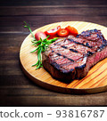 grilled ribeye steak on wooden board 93816787