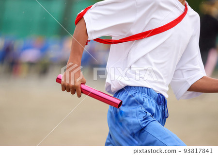 Athletic meet, hand holding a relay baton Athletic meet, hand holding a relay baton 93817841