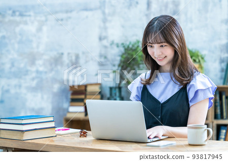 A woman using a laptop in a chic room A woman using a laptop in a chic room 93817945