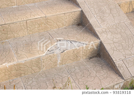 Broken tiles on the rung of the stairs 93819318