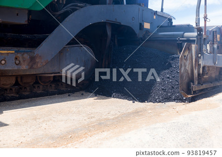 Paver machine on a new asphalt road surface. Paver machine on a new asphalt road surface. 93819457