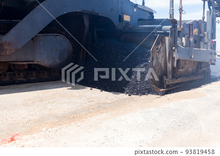 Paver machine on a new asphalt road surface. Paver machine on a new asphalt road surface. 93819458