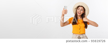 Young Caucasian woman enjoying the selfie with herself isolated on white background summer travel concept. Young Caucasian woman enjoying the selfie with herself isolated on white background summer travel concept. 93819726