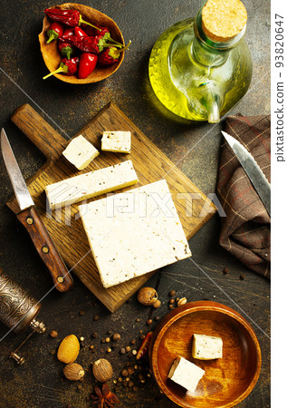 Bowl with tasty tofu cheese on table Bowl with tasty tofu cheese on table 93820647