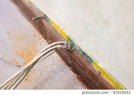 Modem wires on a gray floor background 93820842