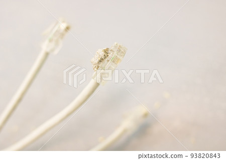 Modem wires on a gray floor background 93820843