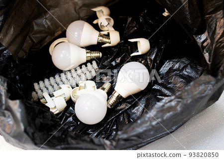 A bunch of light bulbs in a black bag A bunch of light bulbs in a black bag 93820850