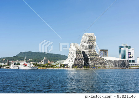 Building view of Kaohsiung Music Center in Taiwan. The white hexagonal building structure on the shore of Kaohsiung Port. Building view of Kaohsiung Music Center in Taiwan. The white hexagonal building structure on the shore of Kaohsiung Port. 93821146
