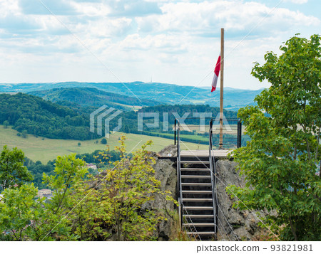 Flag of Ceska Kamenice town flying in the wind on wooden pole. Ceska Kamenice town symbol, Czech Republic 93821981