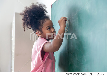Kid write on chalk board. Back to school. Schoolchild in class. Happy kid writing green blackboard. Kid write on chalk board. Back to school. Schoolchild in class. Happy kid writing green blackboard. 93822177