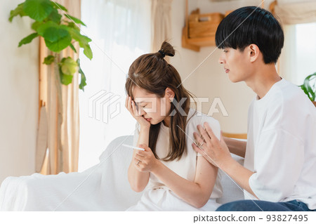 A couple checking the pregnancy test A couple checking the pregnancy test 93827495