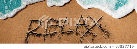 Relaxation by the Nature Concept. Relax text on Sand Beach with Soft Blue Wave on Summer Sunny Day. Top View Relaxation by the Nature Concept. Relax text on Sand Beach with Soft Blue Wave on Summer Sunny Day. Top View 93827719