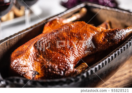 Traditionally roasted goose in an original baking dish Traditionally roasted goose in an original baking dish 93828521