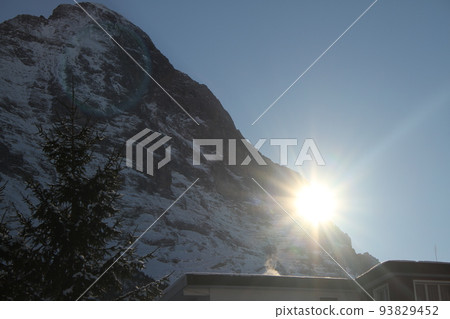 The Eiger and the sun as seen from Grindelwald, Switzerland The Eiger and the sun as seen from Grindelwald, Switzerland 93829452