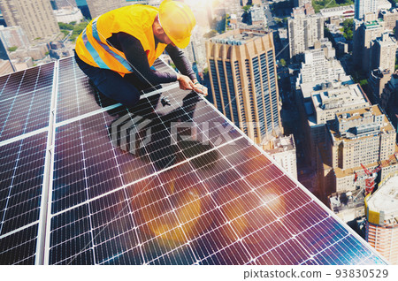 Workers assemble energy system with solar panel for electricity 93830529