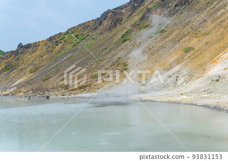 hot mineralized lake with thermal spring and smoking fumaroles in the caldera of the Golovnin volcano on the island of Kunashir 93831153