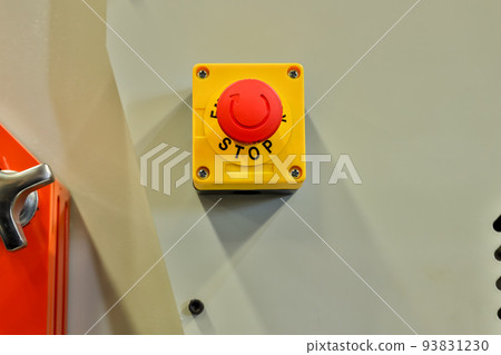 The red emergency button or stop button for Hand press.  93831230