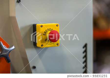 The red emergency button or stop button for Hand press.  93831231