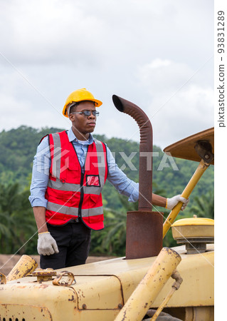Engineer or Worker operator driving excavator on construction building site 93831289