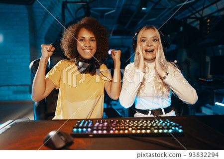 Victory in eSports.Two young women are playing computer games. 93832294