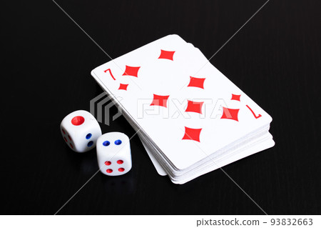 Deck of cards and two dice on wooden table 93832663
