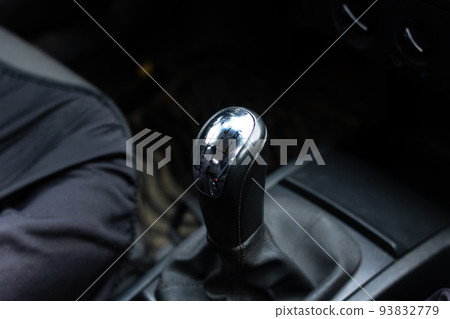 Gearbox knob in car close up in shadow Gearbox knob in car close up in shadow 93832779