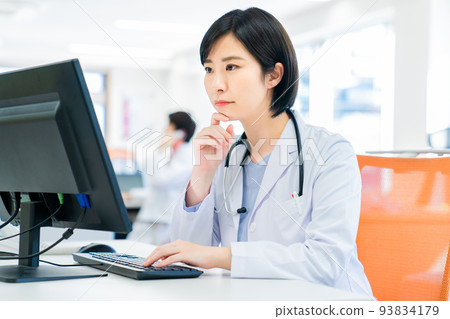 Young female doctor doing online medical treatment 93834179