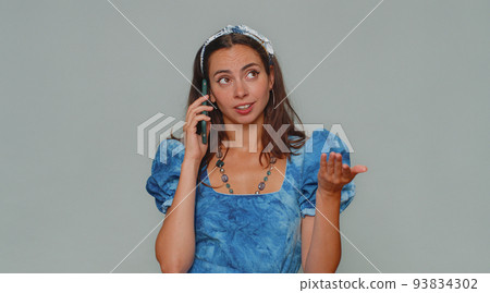Tired sleepy freelancer young woman talking on mobile phone with friend, making online conversation 93834302