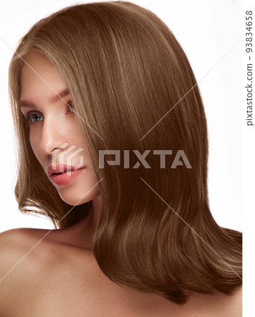 Beautiful brown-haired girl with a perfectly curls hair, and classic make-up. Beauty face and hair. 93834658