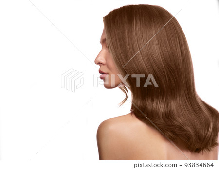 Beautiful brown-haired girl with a perfectly curls hair, and classic make-up. Beauty face and hair. 93834664