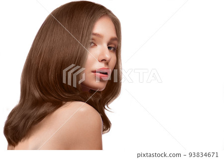 Beautiful brown-haired girl with a perfectly curls hair, and classic make-up. Beauty face and hair. 93834671