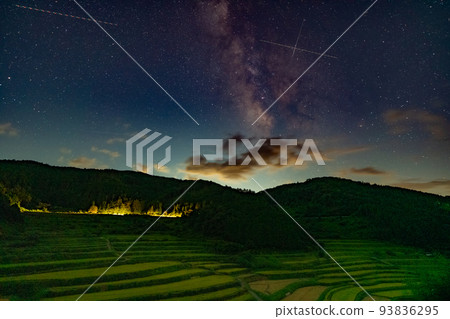Night view image of terraced rice fields (with the Milky Way and meteors) 93836295