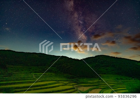 Night view image of terraced rice fields (with the Milky Way and meteors) 93836296