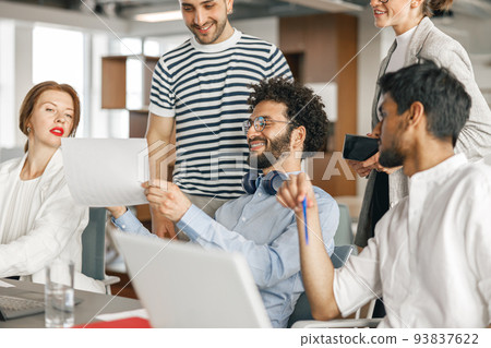 Busy coworkers cooperating and working together at office meeting, teamwork concept 93837622