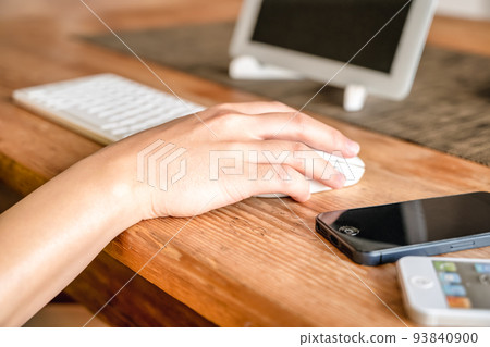 Image cut of a young woman working from home 93840900