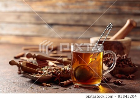 Christmas herbal tea with cinnamon, anise, and dried herbs. 93843204