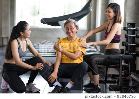 Smiling old man thumb up being massage by women Smiling old man thumb up being massage by women 93846756