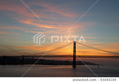 The 25th of April bridge in the harbor city of Lisbon before dawn 93848189