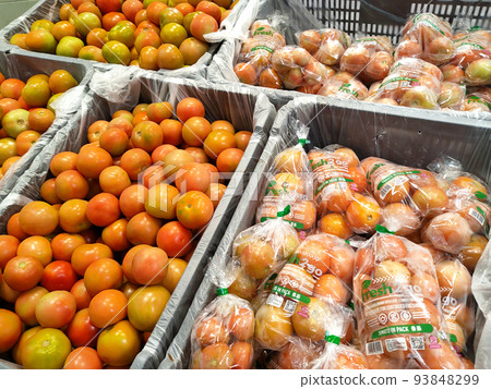 MELAKA, MALAYSIA - JULY 4, 2022: Fresh fruits and vegetables in a supermarket. Some are wrapped in plastic to maintain freshness. Has a price tag and is displayed for sale. MELAKA, MALAYSIA - JULY 4, 2022: Fresh fruits and vegetables in a supermarket. Some are wrapped in plastic to maintain freshness. Has a price tag and is displayed for sale. 93848299