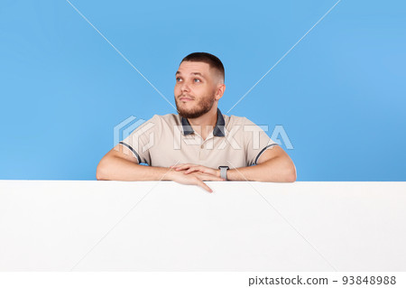 cheerful man holding board with empty copy space cheerful man holding board with empty copy space 93848988