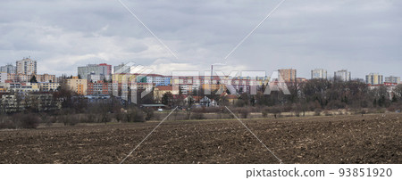 Chodov, Prague, Czech Republic, March 13, 2021: Panoramic view of Housing Estate Chodov with prefabricated buildings or block of flats constructed with panels over the bare field. Cloudy spring day Chodov, Prague, Czech Republic, March 13, 2021: Panoramic view of Housing Estate Chodov with prefabricated buildings or block of flats constructed with panels over the bare field. Cloudy spring day 93851920